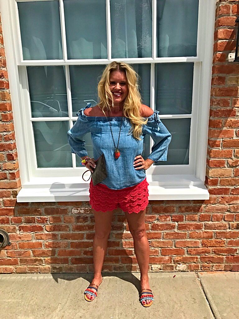 Tuesday's Tip shorter shorts after 40, off the shoulder bow top, orange lace shorts, tassel accessory's, Louise Vuitton clutch