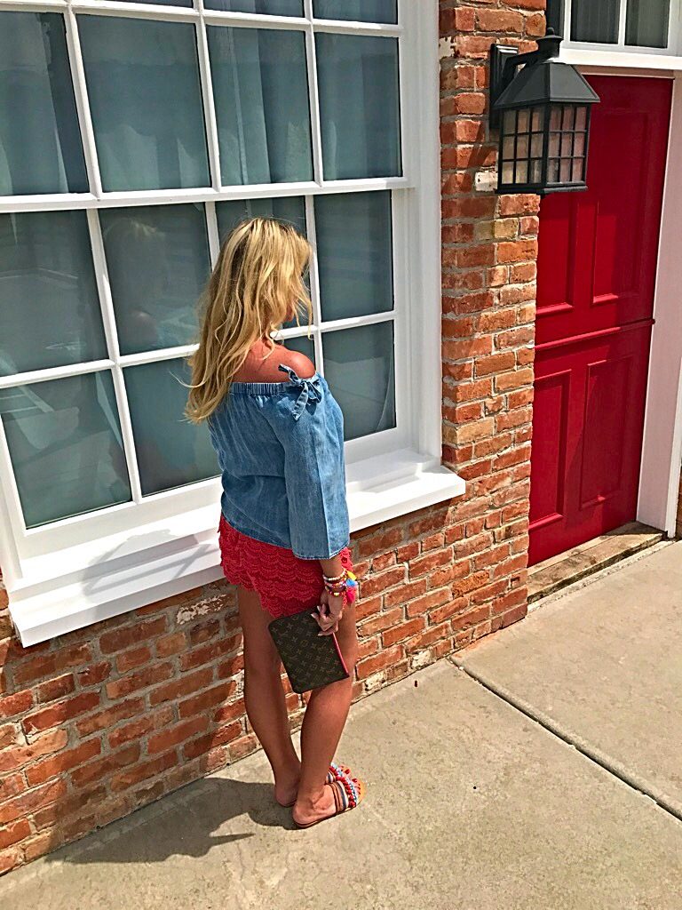 Tuesday's Tip shorter shorts after 40, off the shoulder bow top, orange lace shorts, tassel accessory's, Louise Vuitton clutch