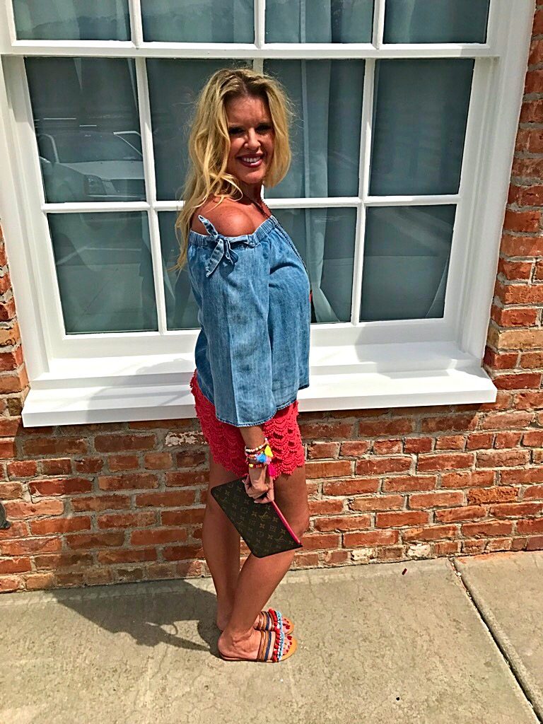 Tuesday's Tip shorter shorts after 40, off the shoulder bow top, orange lace shorts, tassel accessory's, Louise Vuitton clutch
