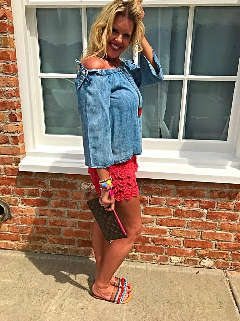 Tuesday's Tip shorter shorts after 40, off the shoulder bow top, orange lace shorts, tassel accessory's, Louise Vuitton clutch