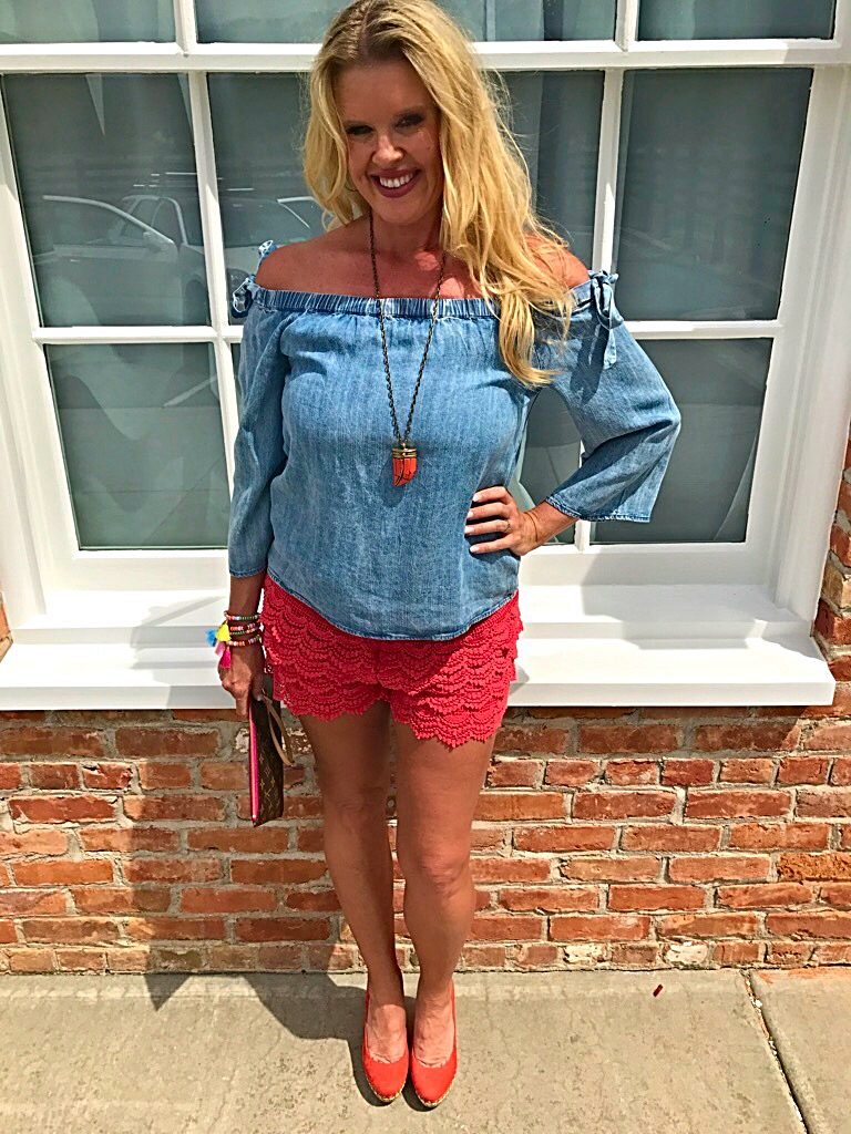 Tuesday's Tip shorter shorts after 40, off the shoulder bow top, orange lace shorts, tassel accessory's, Louise Vuitton clutch