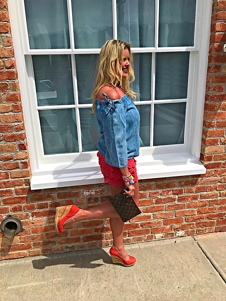 Tuesday's Tip shorter shorts after 40, off the shoulder bow top, orange lace shorts, tassel accessory's, Louise Vuitton clutch